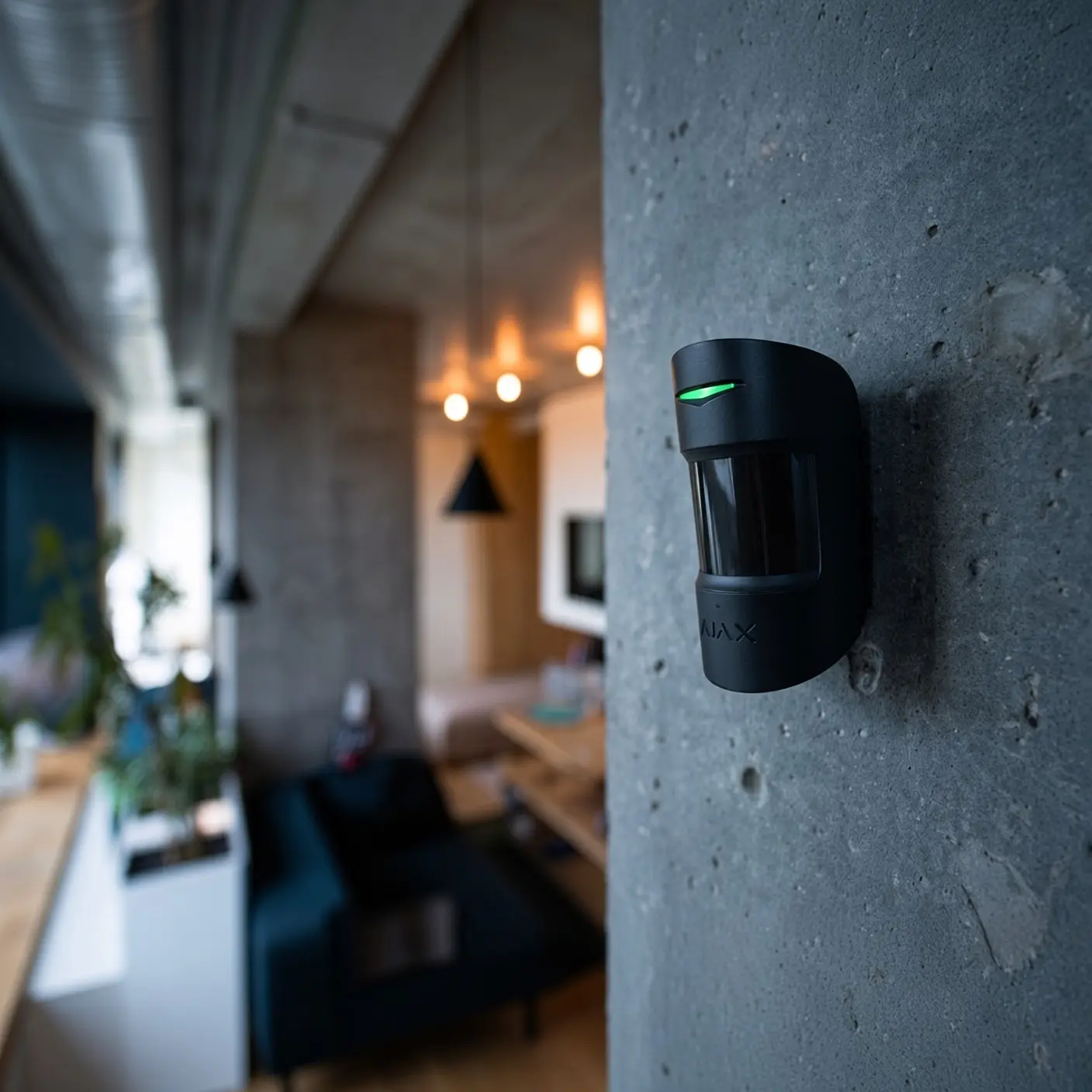 Ajax wireless motion detector mounted on an interior wall